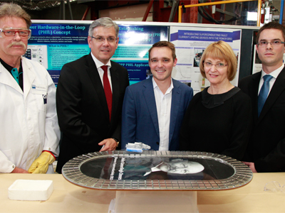 (L-R) Mr Rob Hickey (QUT), Mr Jeff Connolly (Siemens), Mr Wyatt Roy MP (Assistant Innovation Minister), Prof Carol Dickenson (QUT) and Mr Robert Jarvis (DST). (L-R) Mr Rob Hickey (QUT), Mr Jeff Connolly (Siemens), Mr Wyatt Roy MP (Assistant Innovation Minister), Prof Carol Dickenson (QUT) and Mr Robert Jarvis (DST).